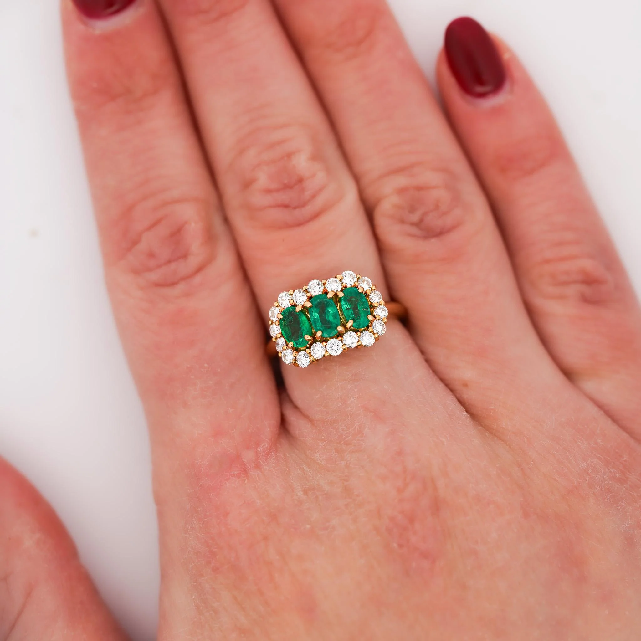 1.22 Carat Emerald & Diamond 18K Gold Halo Three Stone Band Ring - Image 2
