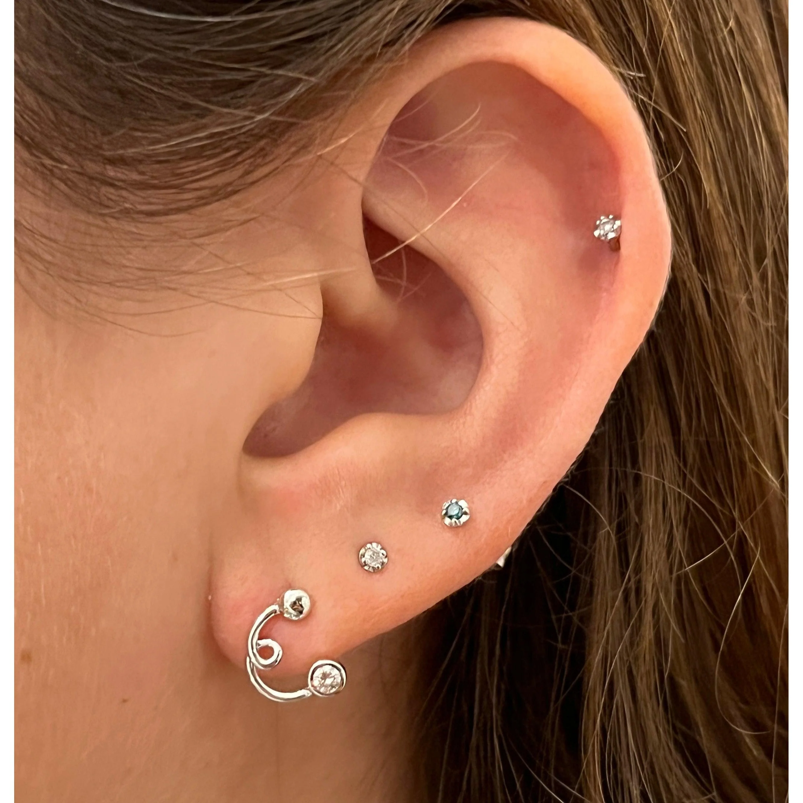 14K White Gold Swirl Earrings With Round Bezel Set Diamonds - Image 4