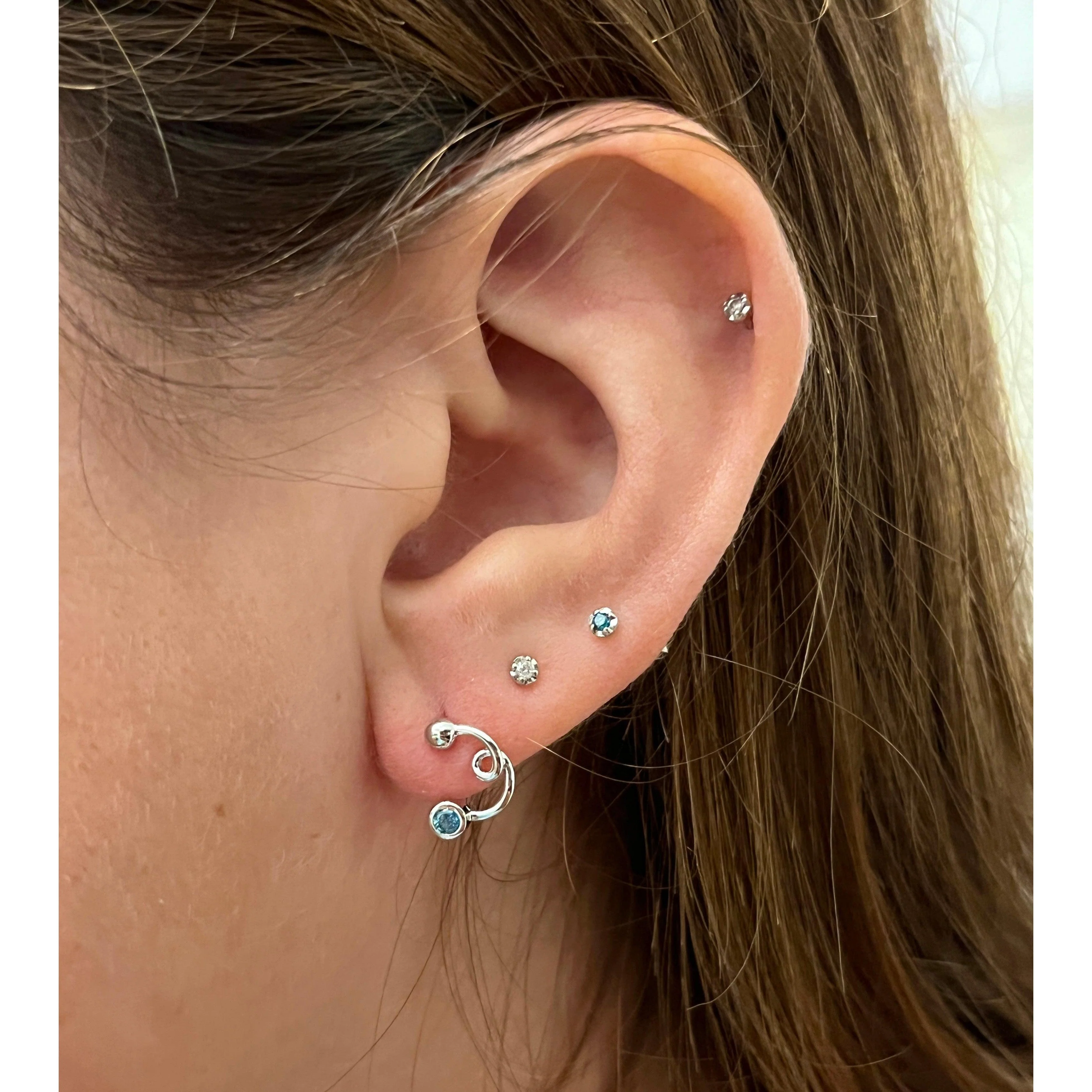 14K White Gold Swirl Earrings With Round Bezel Set Diamonds - Image 5