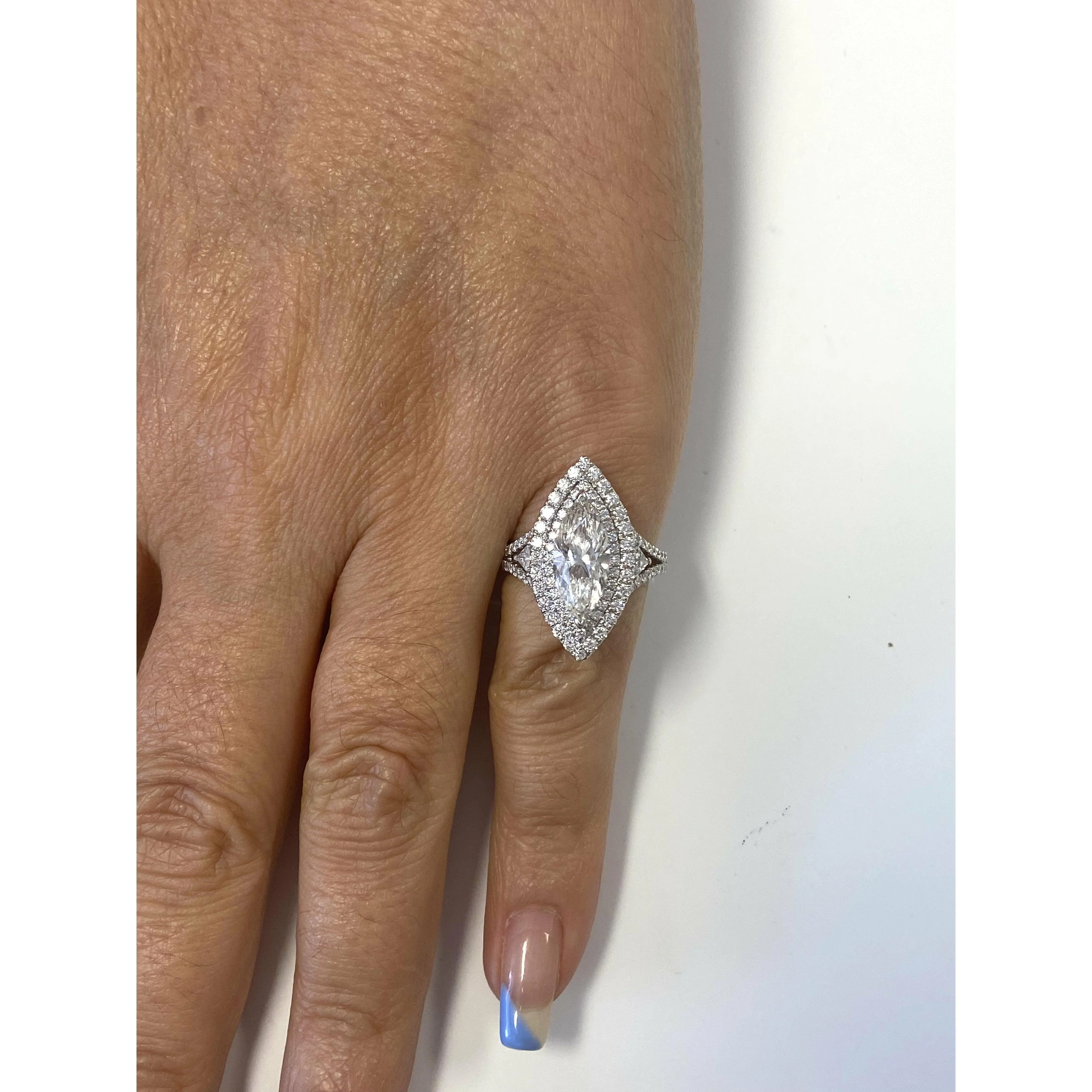 GIA Certified 2.38 Carat Marquis-Cut, H Color, Si1 Clarity Diamond set in 18k white gold and diamond halo ring - Image 3