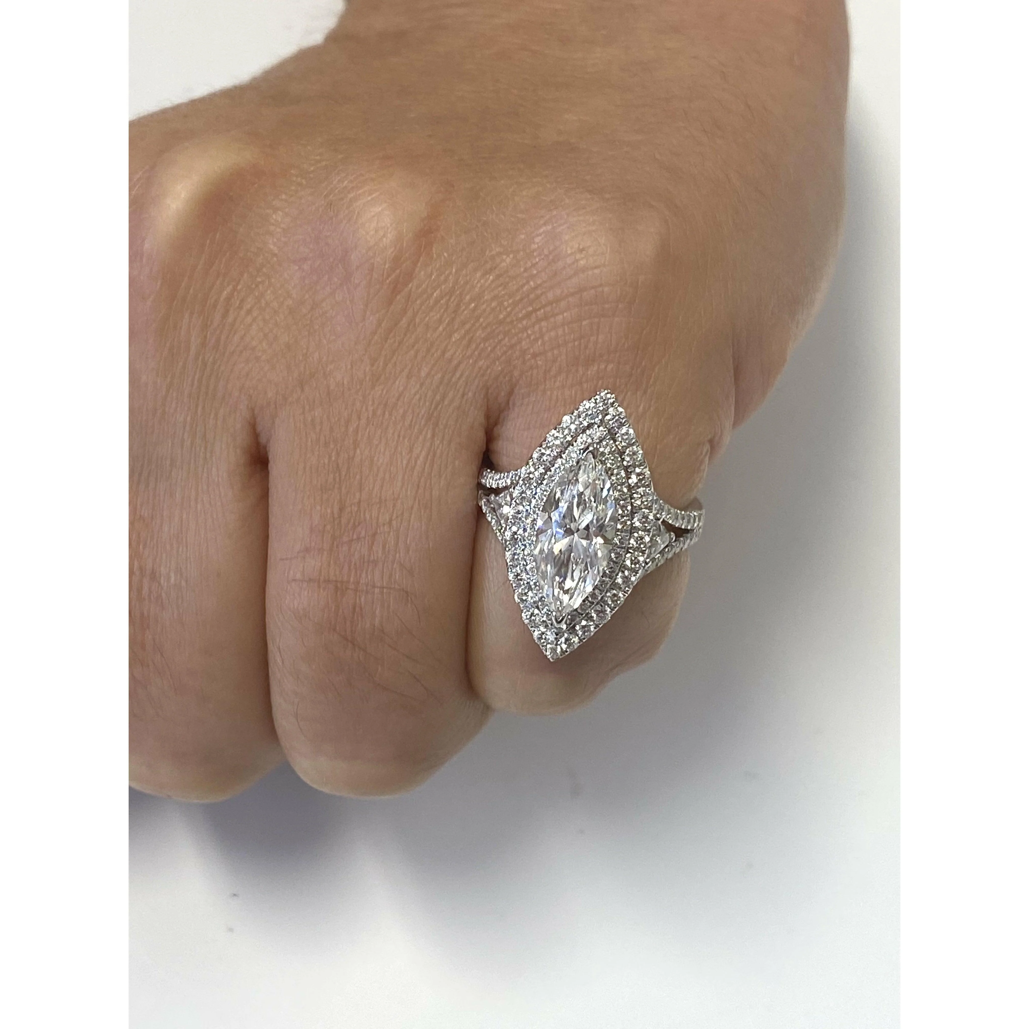 GIA Certified 2.38 Carat Marquis-Cut, H Color, Si1 Clarity Diamond set in 18k white gold and diamond halo ring - Image 4